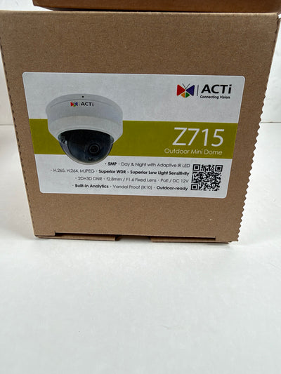 A brown cardboard box for the ACTi Z715 Outdoor Mini Dome security camera, featuring a white label with product details and a camera photo.