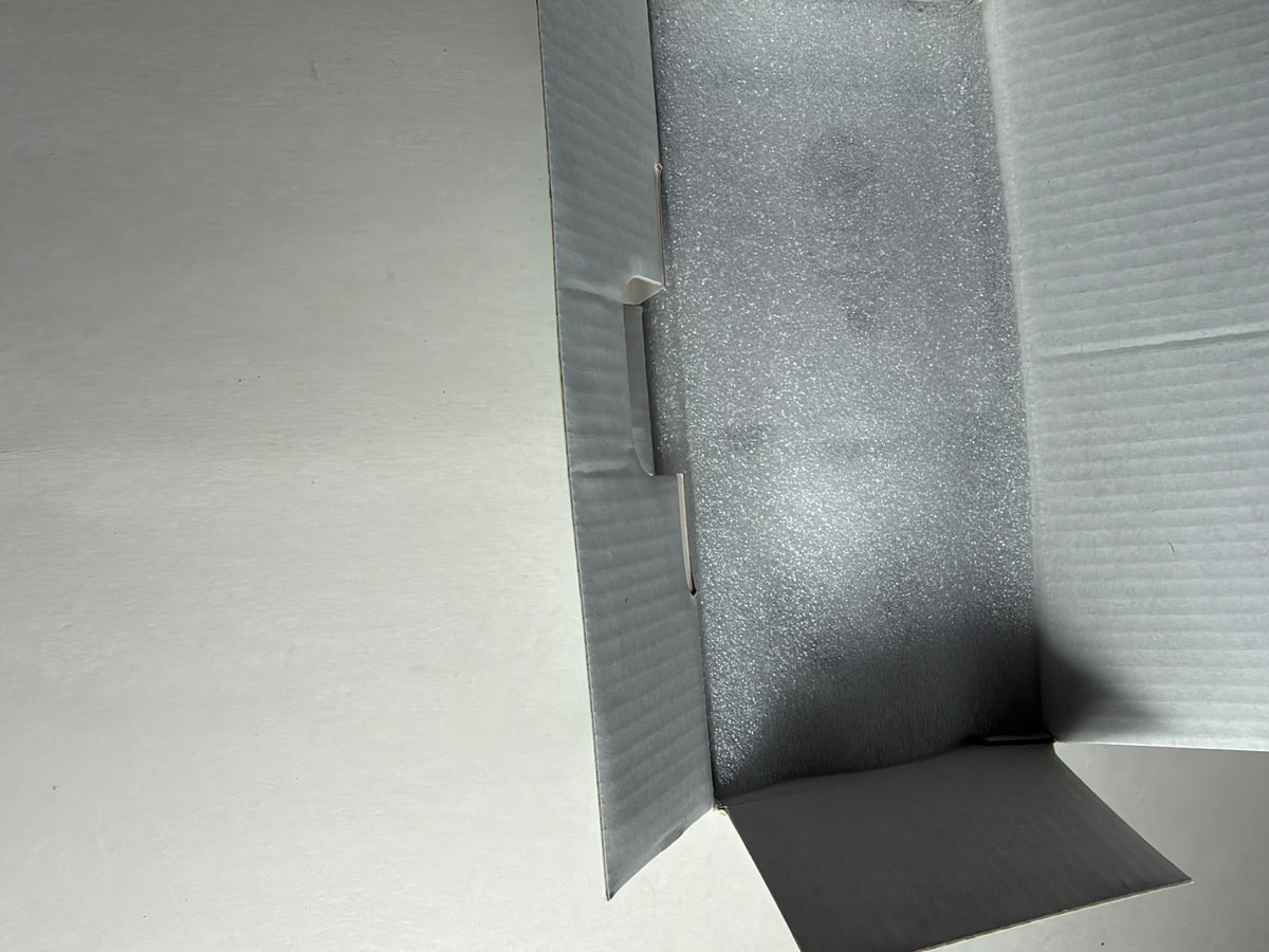 AlkiVision 2K Wireless Security Camera opened retail box showing protective foam packaging.