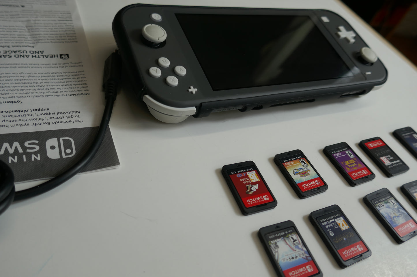 Nintendo Switch Lite Gray Bundle – 512GB SD Card + 9 Game Cartridges (Pokémon, Skyrim, Persona 5, Hogwarts & More)