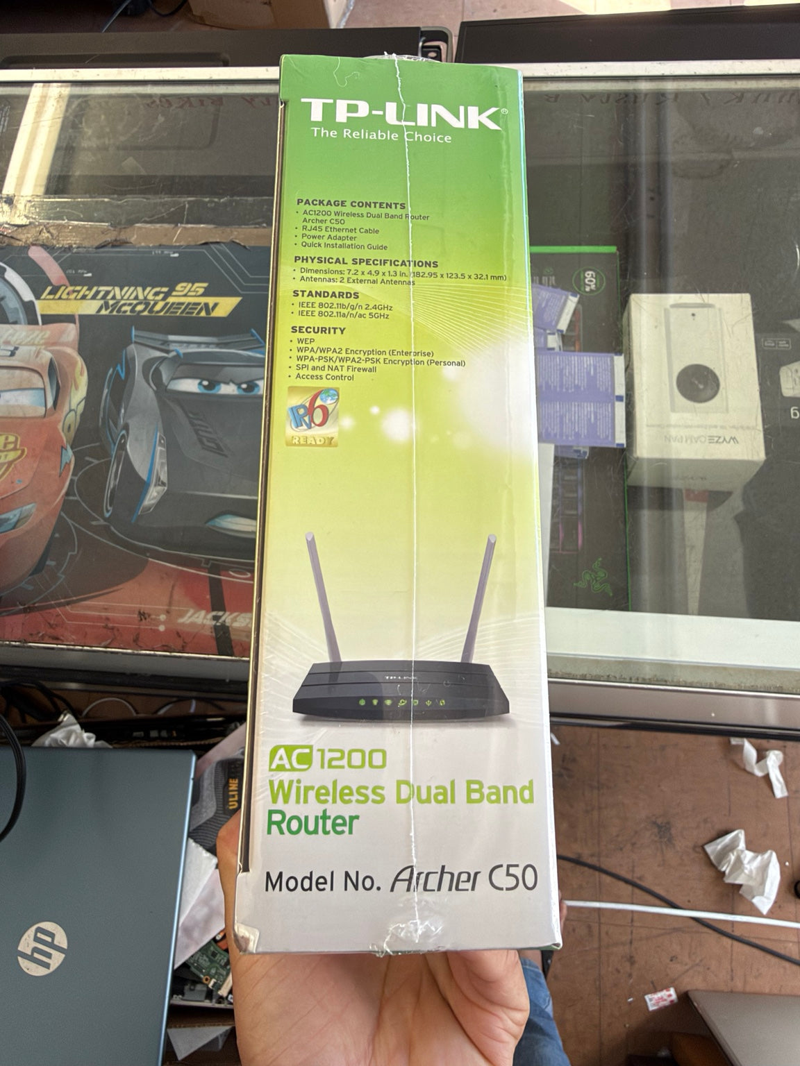 TP-Link Archer C50 AC1200 router original sealed box showing package contents security standards and dual antennas