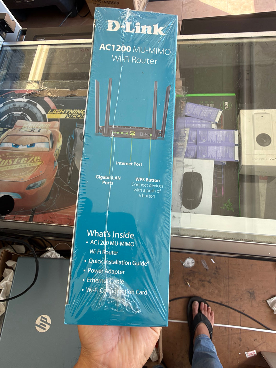D-Link DIR-842 AC1200 Gigabit WiFi Router packaging showing four LAN ports internet port and included accessories