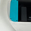 Nintendo Switch console with a bright turquoise blue Joy-Con grip attached to a black body, photographed on a white curved surface.