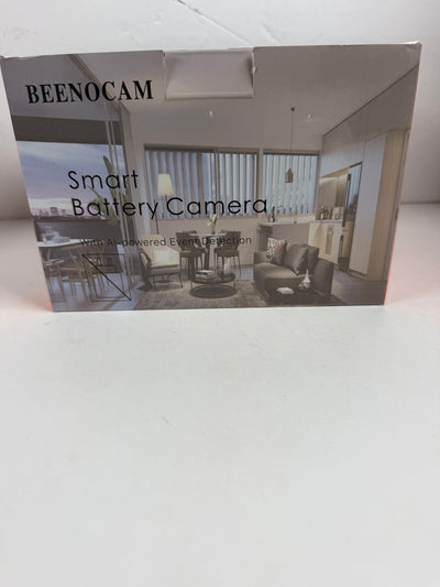 A boxed Beenocam Smart Battery Camera shown on a plain white surface, with the front packaging featuring a modern living room photo and product text.