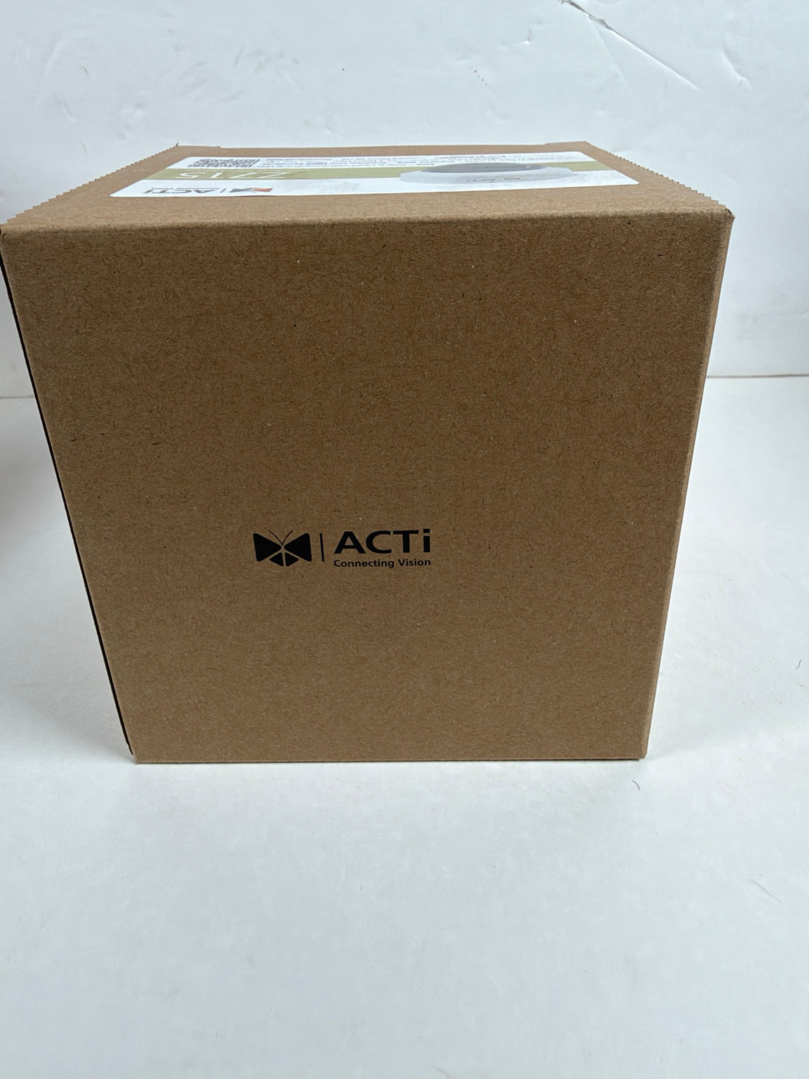 A brown cardboard box with the ACTi logo printed in black on the front, photographed against a plain white background.