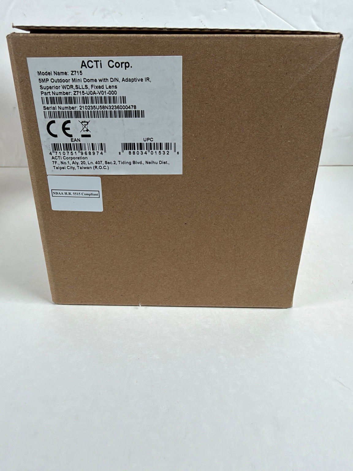 A brown cardboard shipping box with a white product label on the side. The label reads ACTI Corp.
