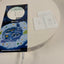 An Abegal 'Moyi I help you' USB-C adapter and its packaging are displayed on a white circular table alongside user manuals and a charging cable.