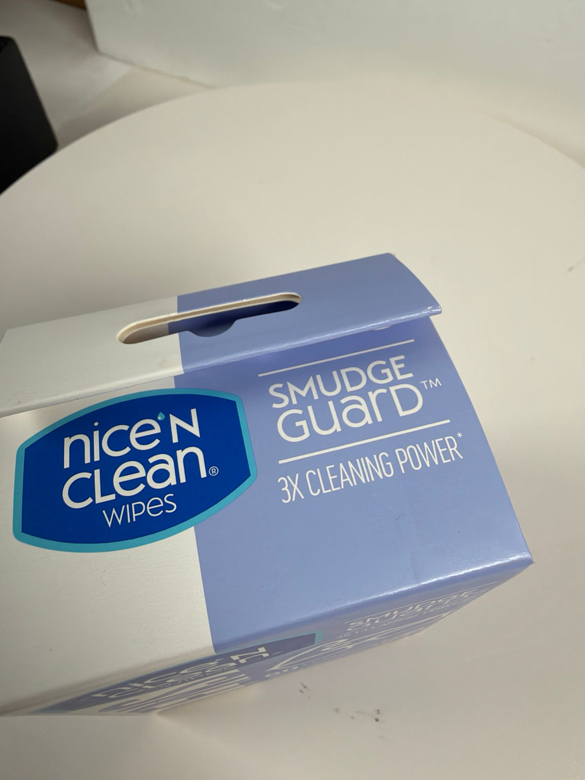 A box of Nice 'N Clean Wipes featuring the Smudge Guard 3X Cleaning Power, shown on a white surface.