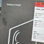 A black Samsung Galaxy Z Fold7 retail box with white branding and curved graphic lines, shown next to a white shipping/pickup label with red header.