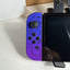 Nintendo Switch OLED Splatoon 3 Special Edition front view with purple and neon green Joy-Con controllers