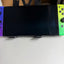 Nintendo Switch OLED Splatoon 3 Edition front OLED screen and colorful Joy-Con controllers