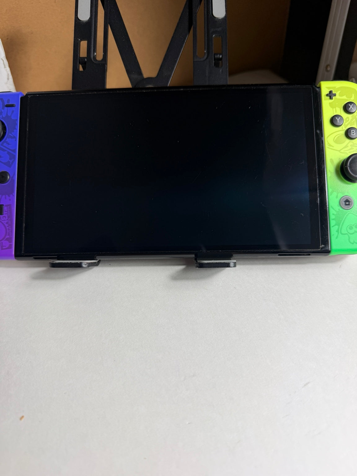Nintendo Switch OLED Splatoon 3 Edition front OLED screen and colorful Joy-Con controllers