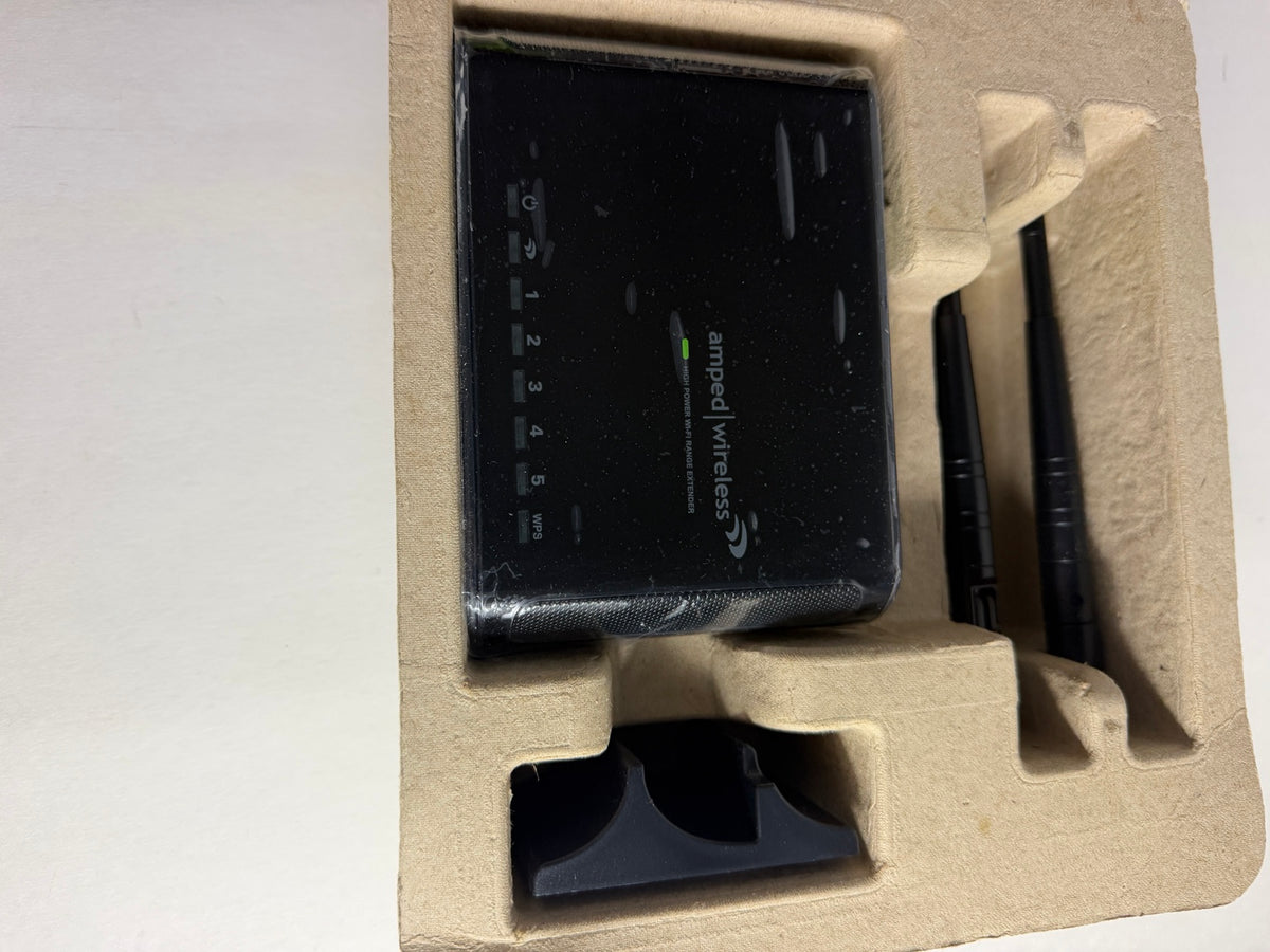 An Amed Wireless router in its original beige cardboard packaging insert, alongside two black antennas and a black accessory piece.