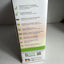 A tall white product box for Amped Wireless, showing feature callouts in black text with green and gray accents, photographed on a gray surface.