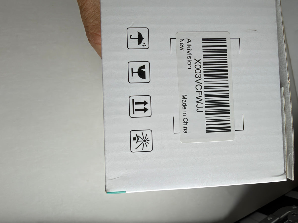 AlkiVision Wireless Light Bulb Camera original retail packaging showing product barcode and manufacturer information.