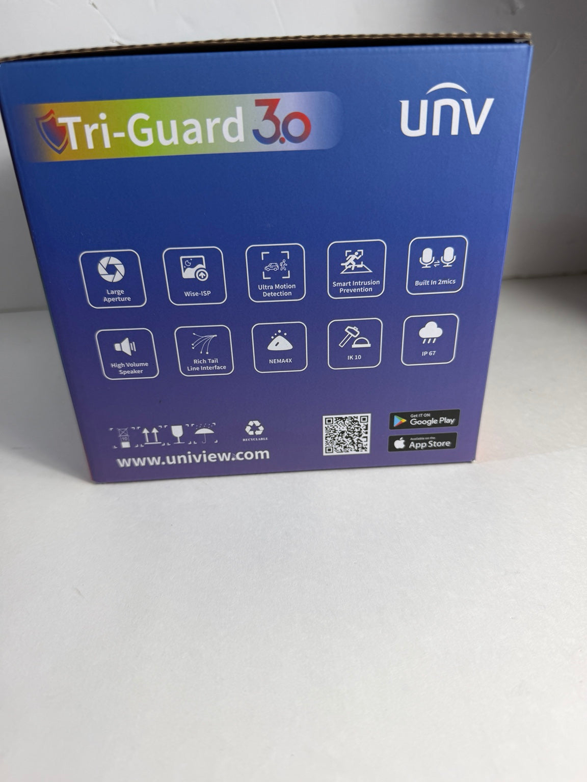 The back of a blue and purple UniView Tri-Guard 30 camera box, showing feature icons, the UniView logo, and a QR code on a light gray surface.