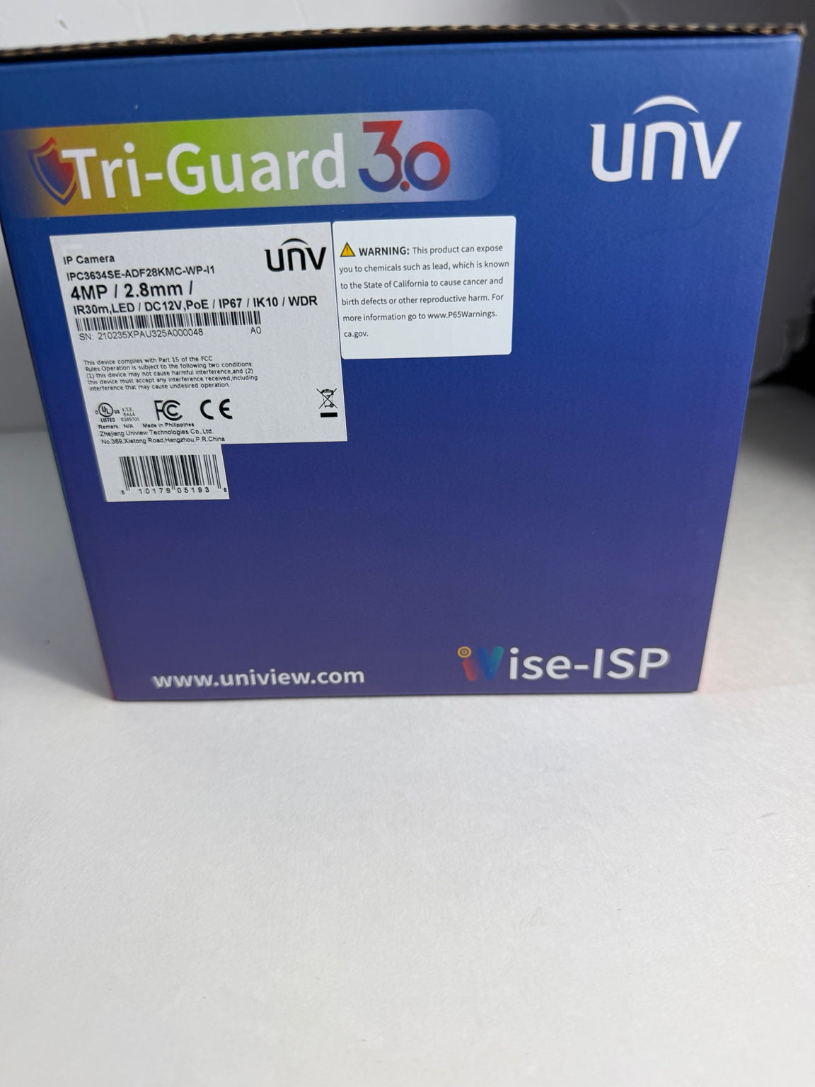 The back of a blue Uniview UniV Tri-Guard 30 display panel enclosure box, showing product specifications, barcodes, and branding.