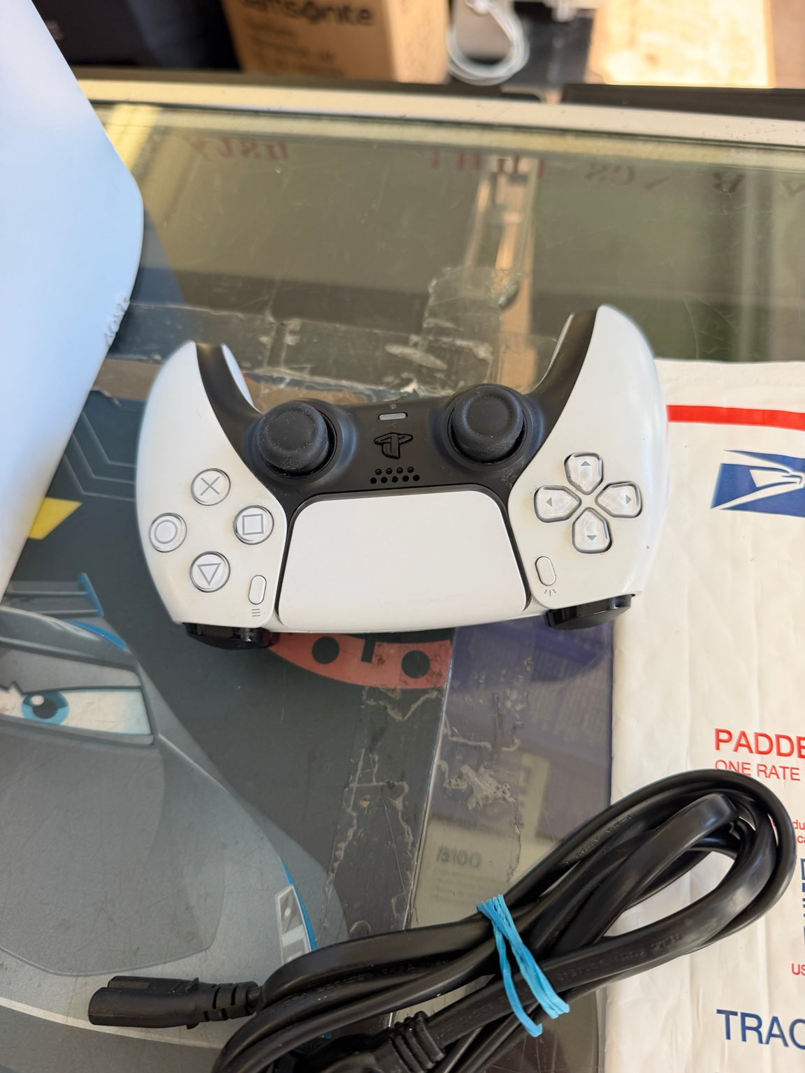 Sony PlayStation 5 DualSense wireless controller with power cord
