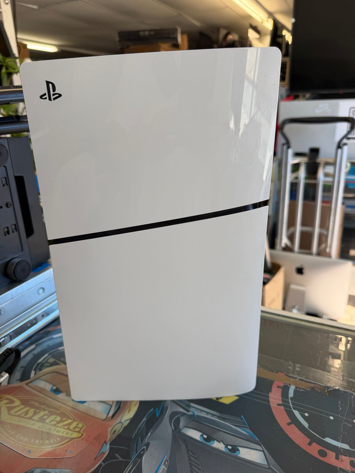 Sony PS5 Slim Disc Edition side view with PlayStation logo