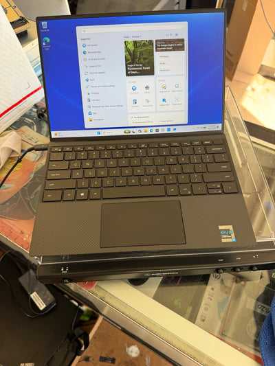 Dell XPS 13 9310 open showing 13.4-inch FHD+ display and keyboard