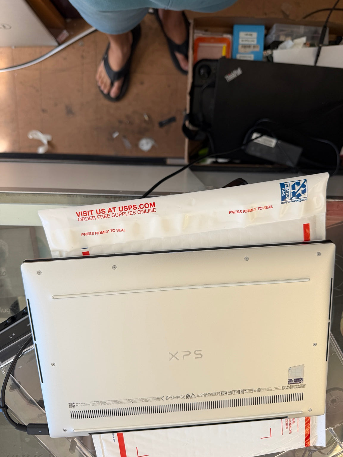 Dell XPS 13 9310 silver bottom cover showing ventilation and XPS logo