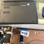 Lenovo ThinkPad E14 laptop bottom panel with cooling vents and Windows sticker