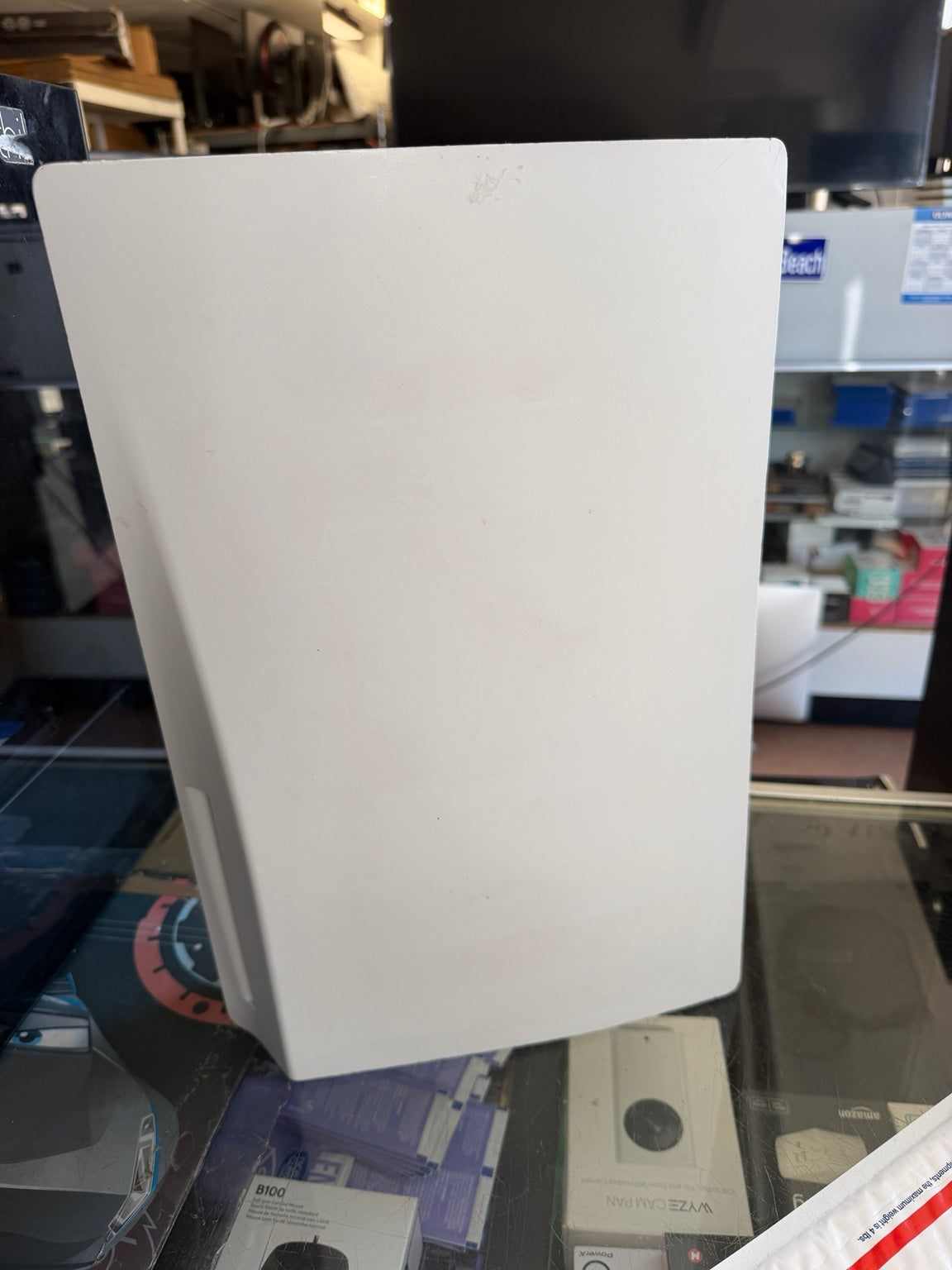 Close-up of Sony PS5 Disc Edition white exterior panel showing surface wear
