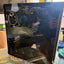 Custom gaming PC tempered glass side panel showing internal components