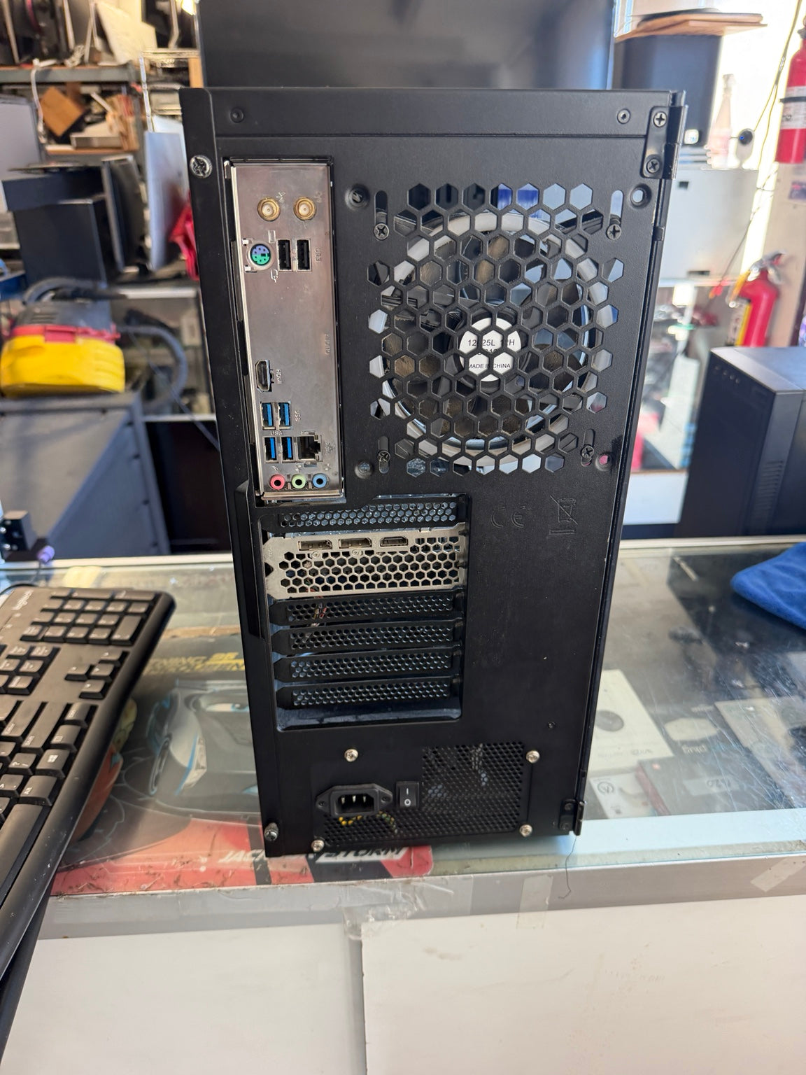 Custom gaming desktop rear panel showing USB HDMI DisplayPort Ethernet and audio ports