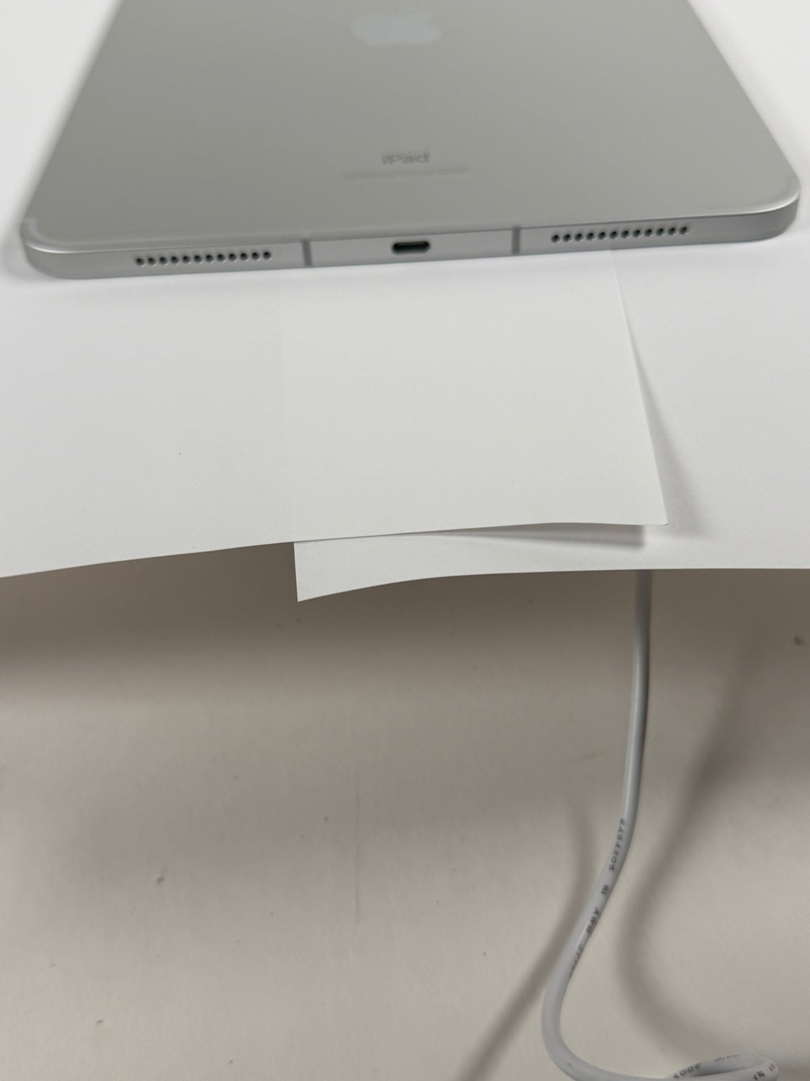 Apple iPad 10th Gen Silver USB-C charging port and speakers