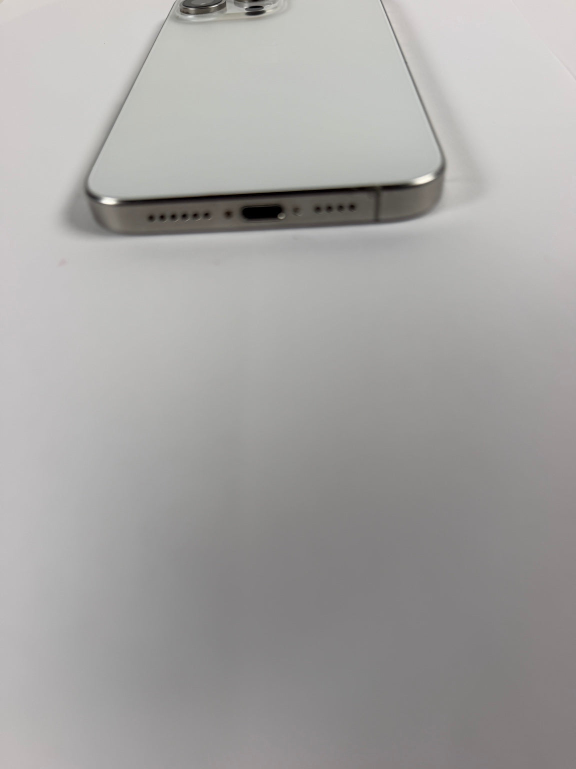 Apple iPhone 15 Pro Max Natural Titanium bottom USB-C port and speakers
