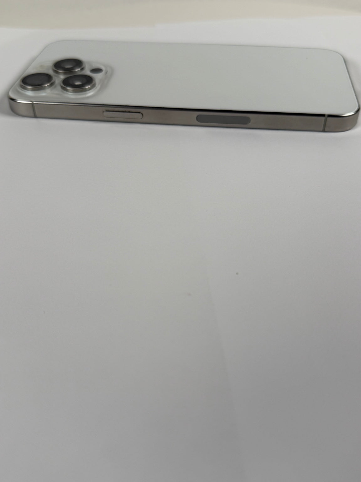 Apple iPhone 15 Pro Max Natural Titanium side frame and buttons