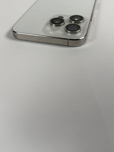 Apple iPhone 15 Pro Max Natural Titanium triple rear camera close-up