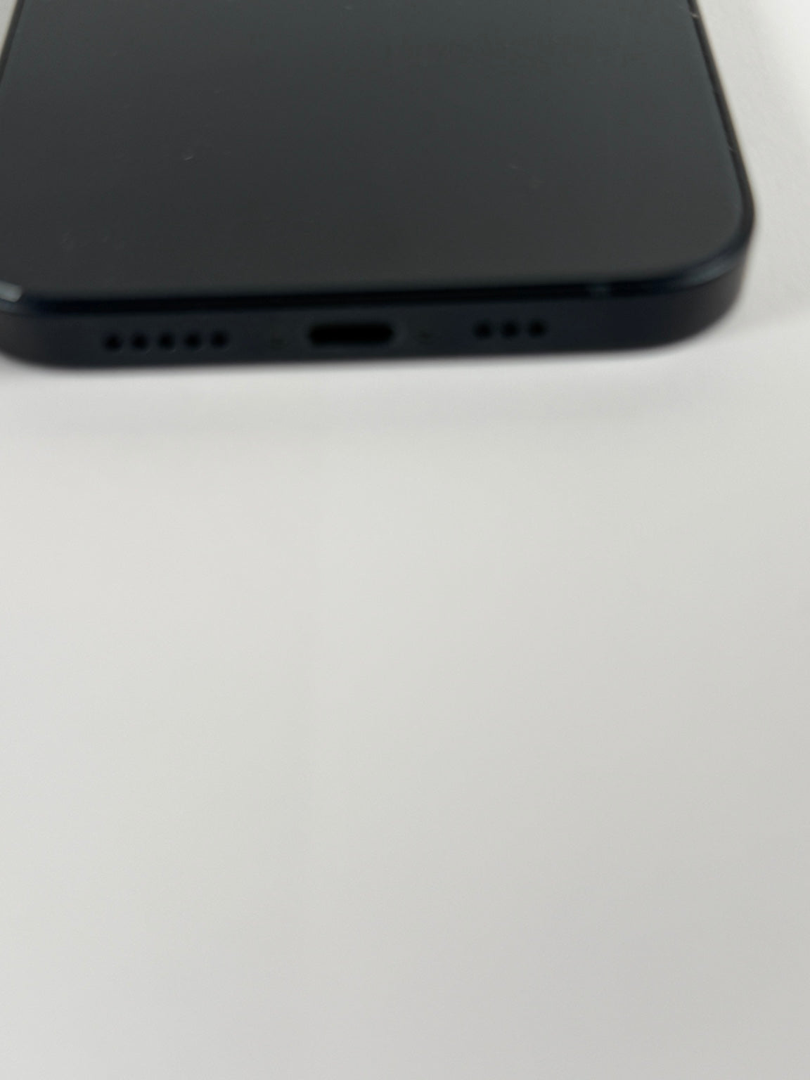 Apple iPhone 13 bottom Lightning charging port and speaker grille