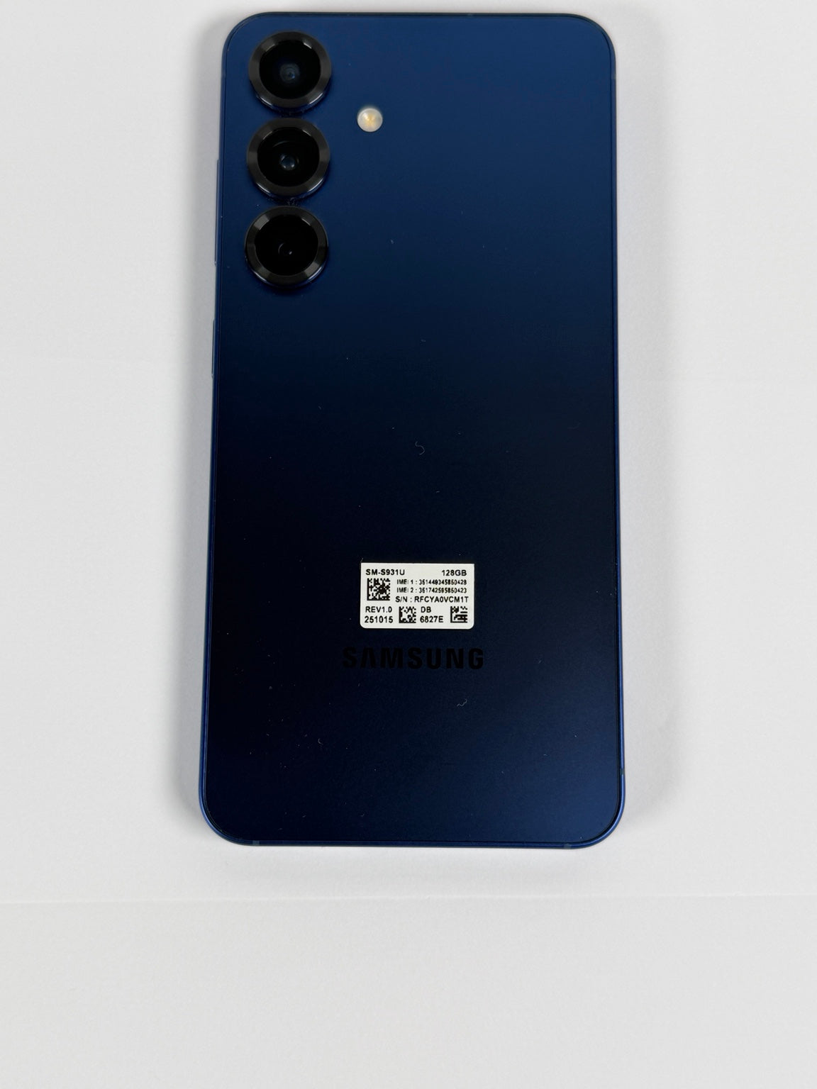 Samsung Galaxy S25 SM-S931U Navy Blue rear view showing triple cameras