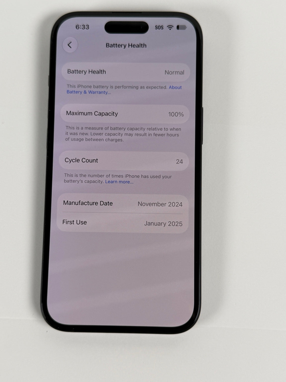Apple iPhone 15 Black showing 100 percent battery health and 24 cycles