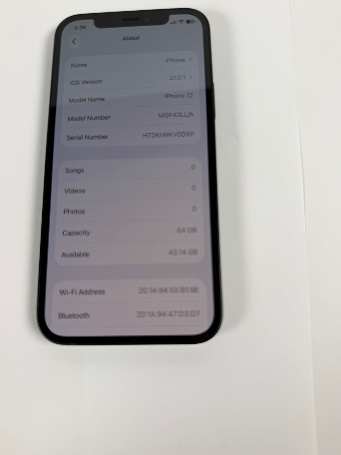 Apple iPhone 12 64GB Black model and storage information screen