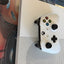 White Microsoft Xbox One S console and matching wireless controller top view