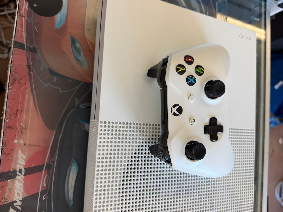 White Microsoft Xbox One S console and matching wireless controller top view