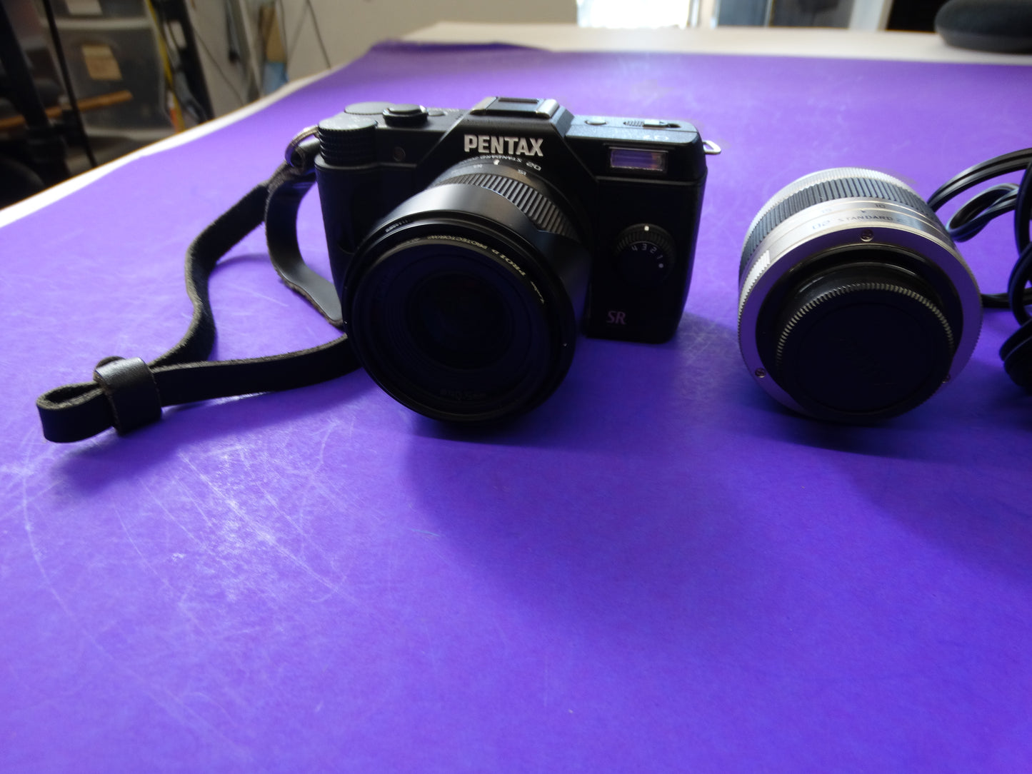 Pentax Q7 Mirrorless Camera Kit – Body + 2 Lenses (Pentax 02 Standard Zoom) + Charger & Strap
