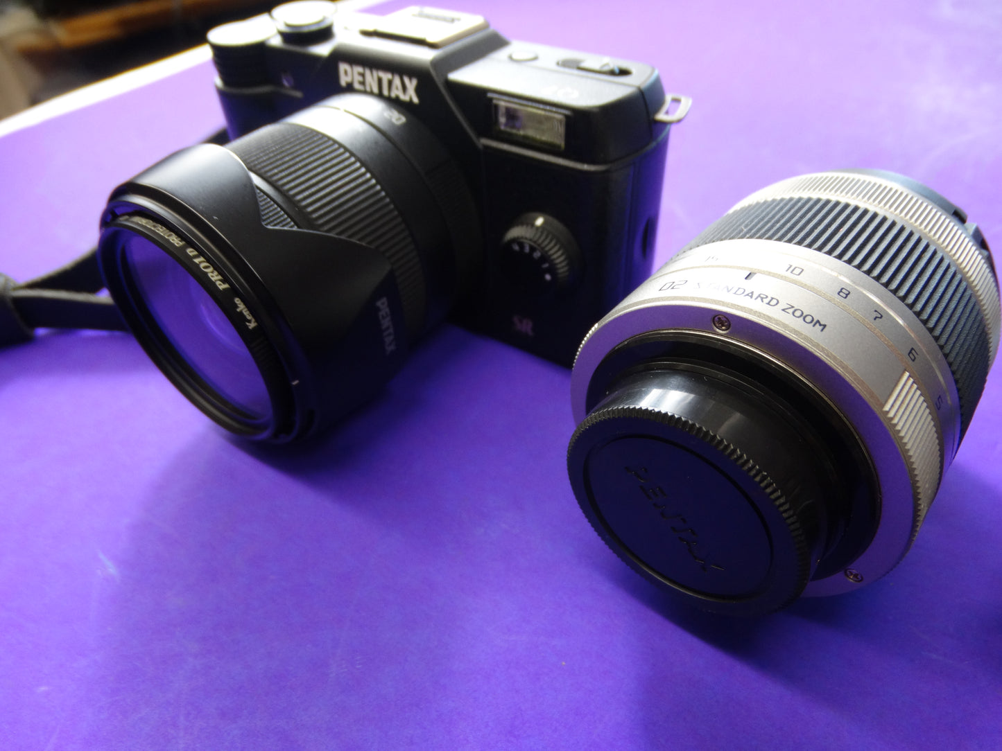 Pentax Q7 Mirrorless Camera Kit – Body + 2 Lenses (Pentax 02 Standard Zoom) + Charger & Strap