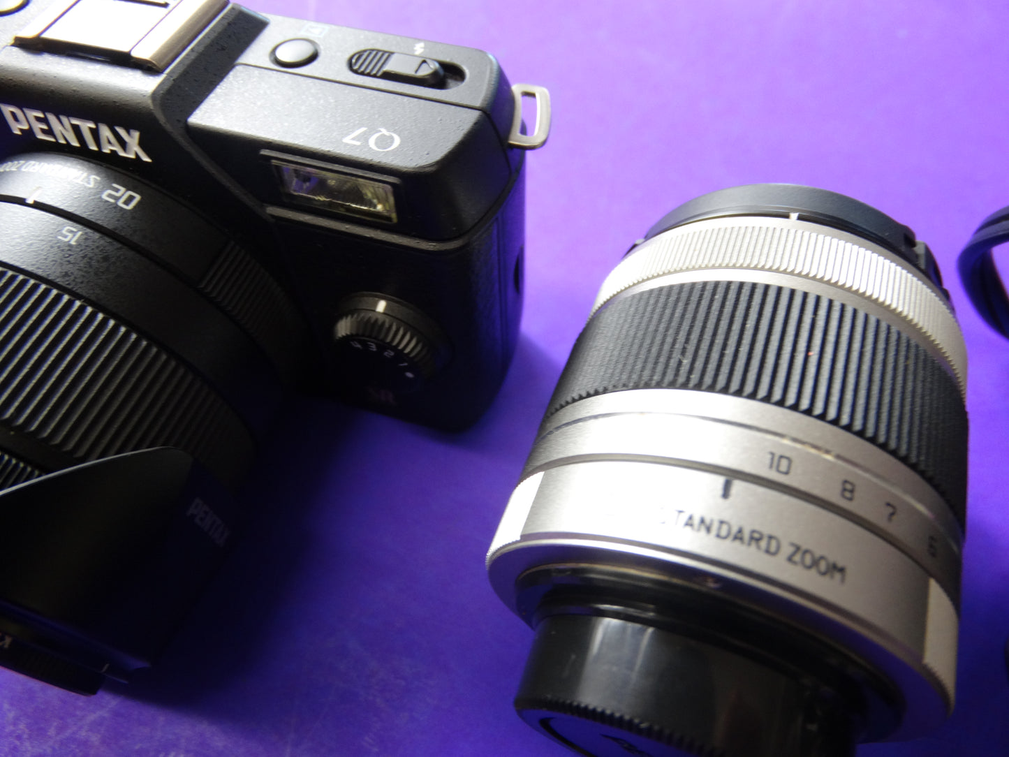 Pentax Q7 Mirrorless Camera Kit – Body + 2 Lenses (Pentax 02 Standard Zoom) + Charger & Strap