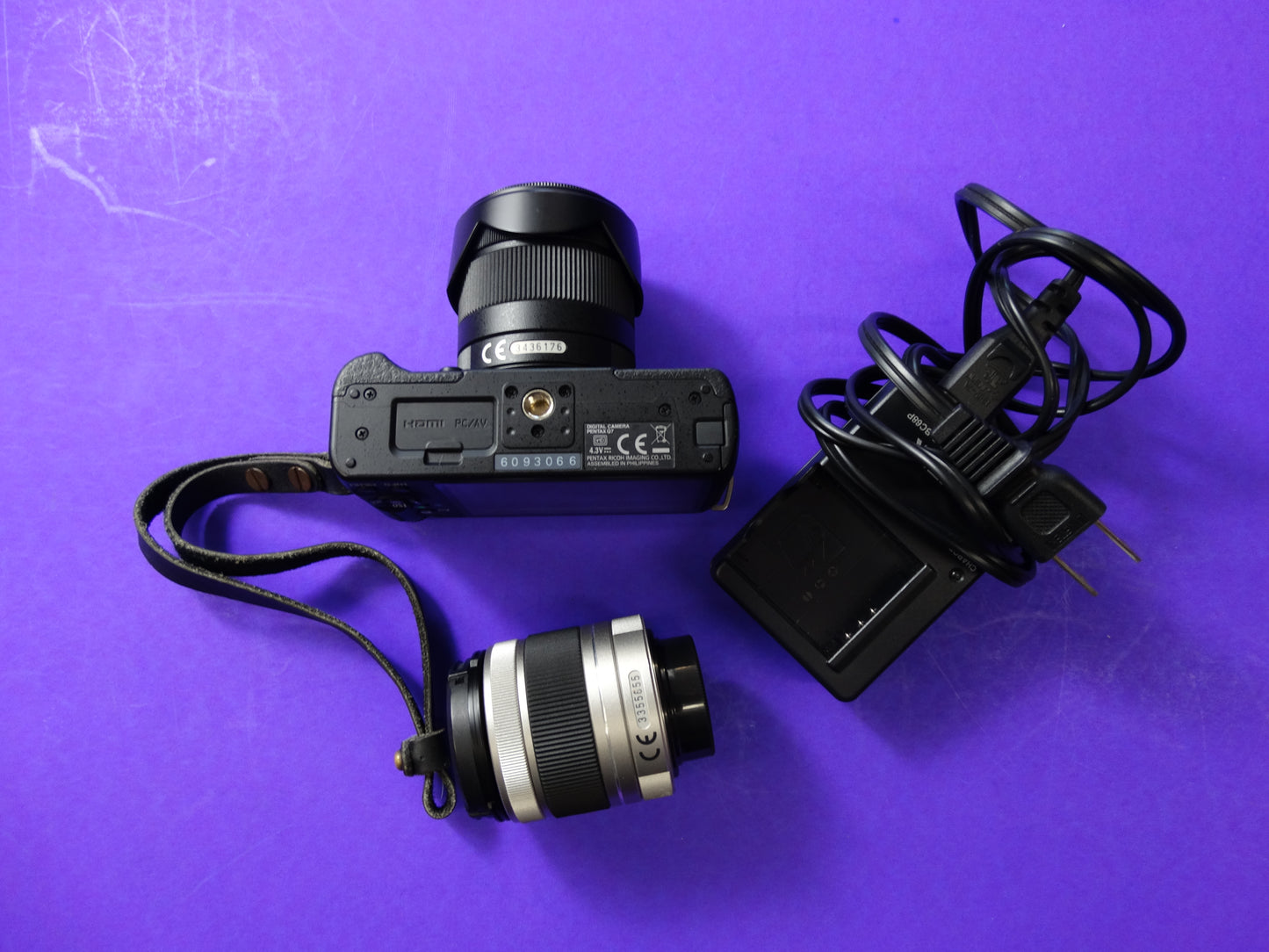 Pentax Q7 Mirrorless Camera Kit – Body + 2 Lenses (Pentax 02 Standard Zoom) + Charger & Strap
