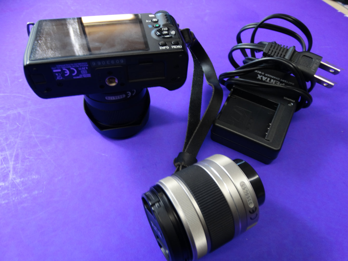 Pentax Q7 Mirrorless Camera Kit – Body + 2 Lenses (Pentax 02 Standard Zoom) + Charger & Strap