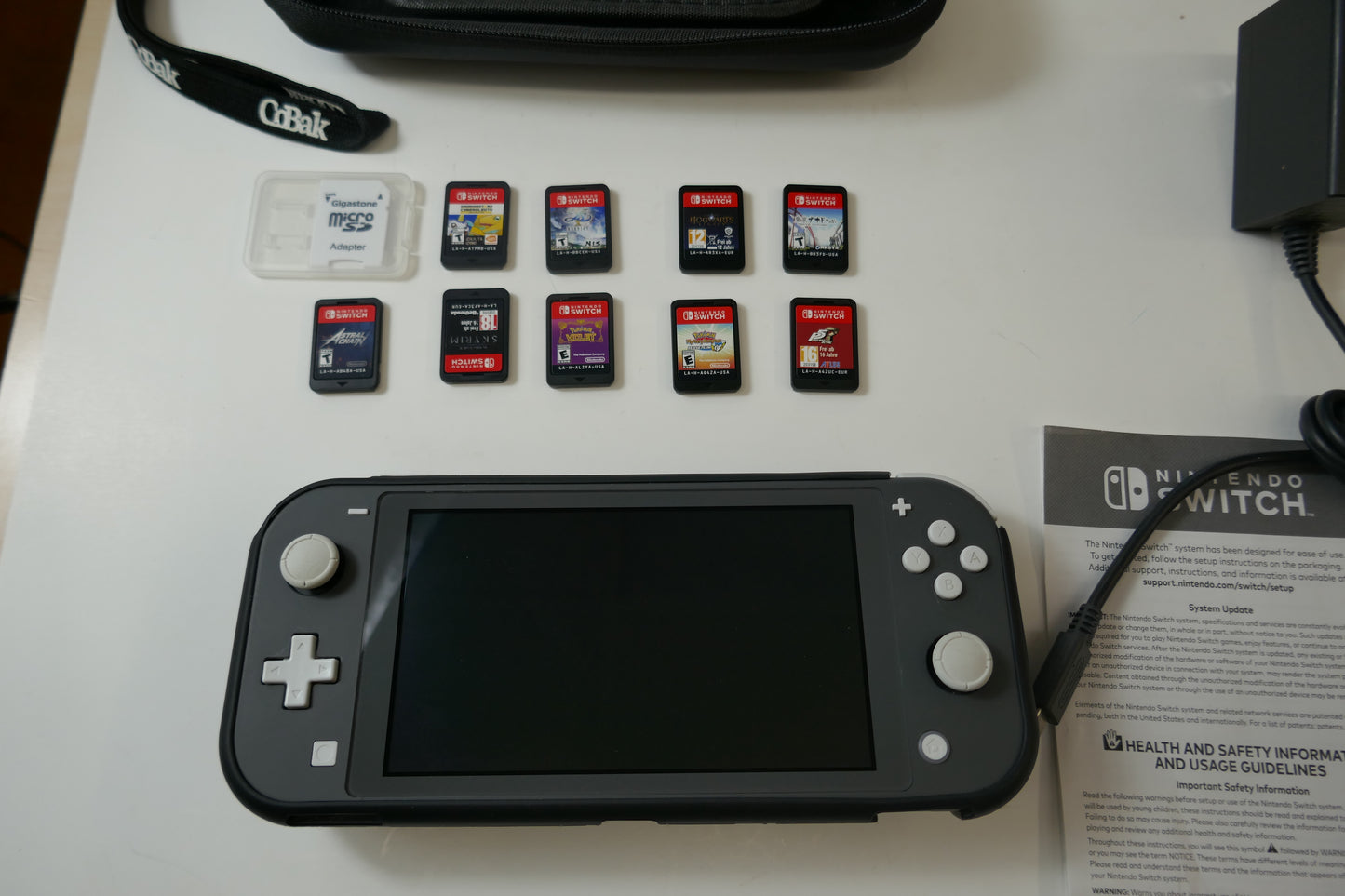 Nintendo Switch Lite Gray Bundle – 512GB SD Card + 9 Game Cartridges (Pokémon, Skyrim, Persona 5, Hogwarts & More)