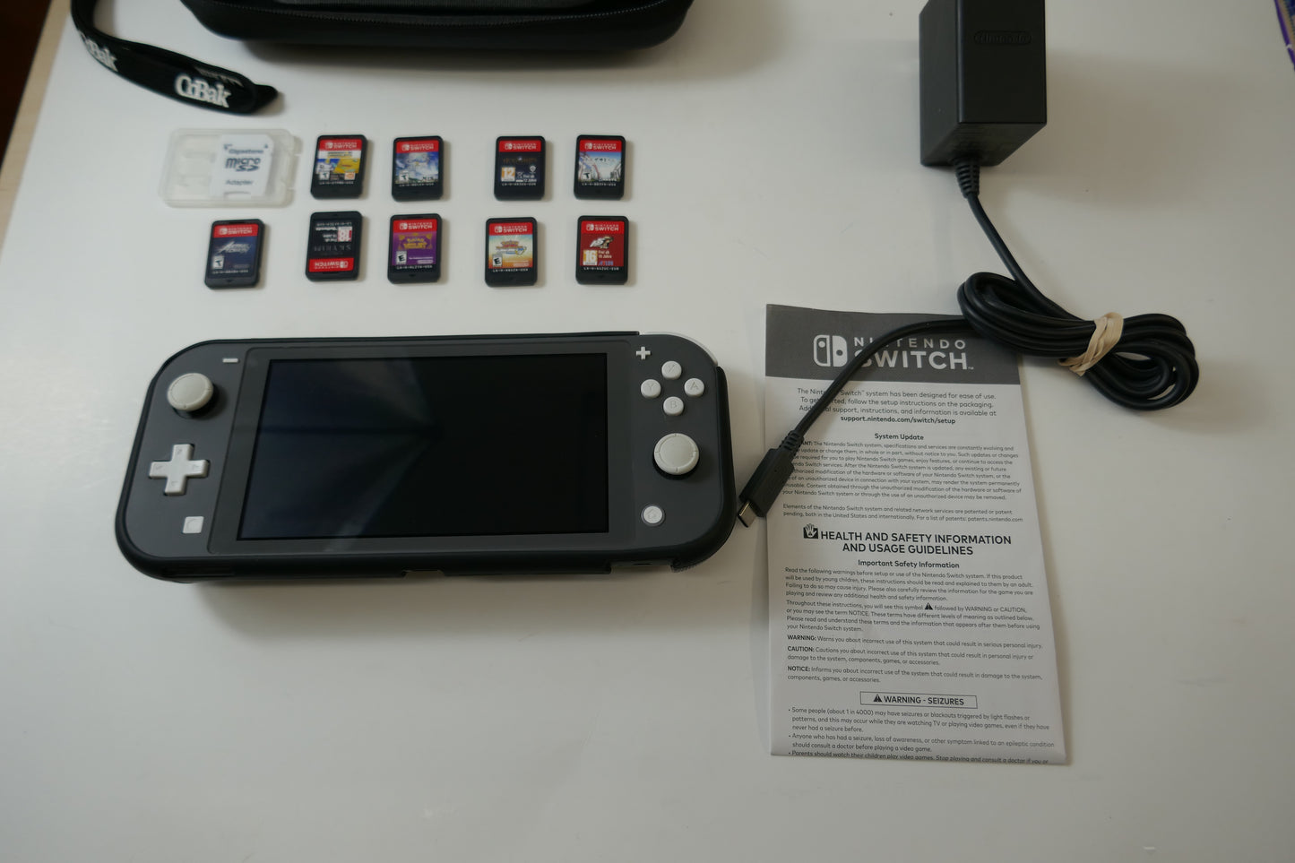 Nintendo Switch Lite Gray Bundle – 512GB SD Card + 9 Game Cartridges (Pokémon, Skyrim, Persona 5, Hogwarts & More)