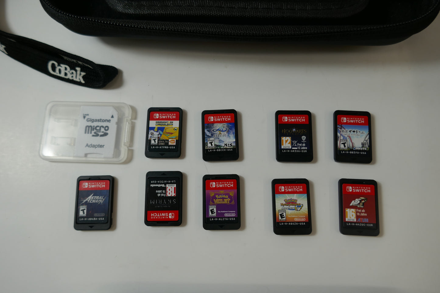 Nintendo Switch Lite Gray Bundle – 512GB SD Card + 9 Game Cartridges (Pokémon, Skyrim, Persona 5, Hogwarts & More)