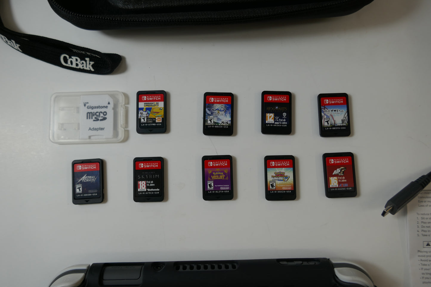Nintendo Switch Lite Gray Bundle – 512GB SD Card + 9 Game Cartridges (Pokémon, Skyrim, Persona 5, Hogwarts & More)
