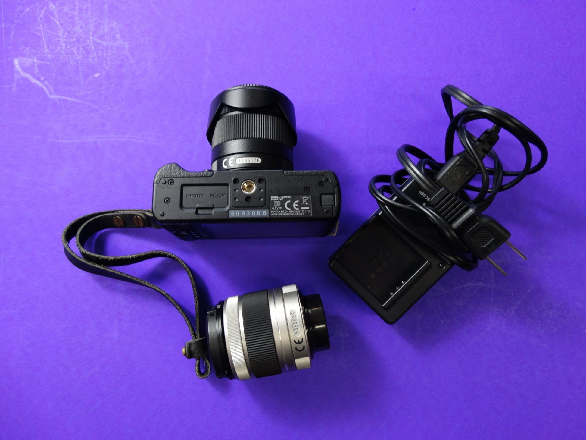 Pentax Q7 Mirrorless Camera Kit – Body + 2 Lenses (Pentax 02 Standard Zoom) + Charger & Strap - WeBuyElectronic