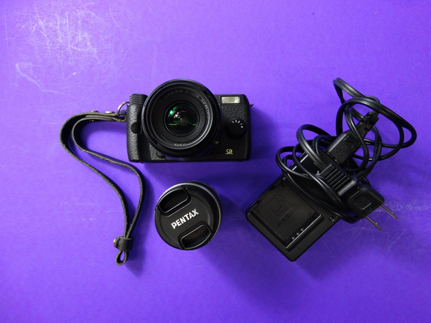 Pentax Q7 Mirrorless Camera Kit – Body + 2 Lenses (Pentax 02 Standard Zoom) + Charger & Strap - WeBuyElectronic