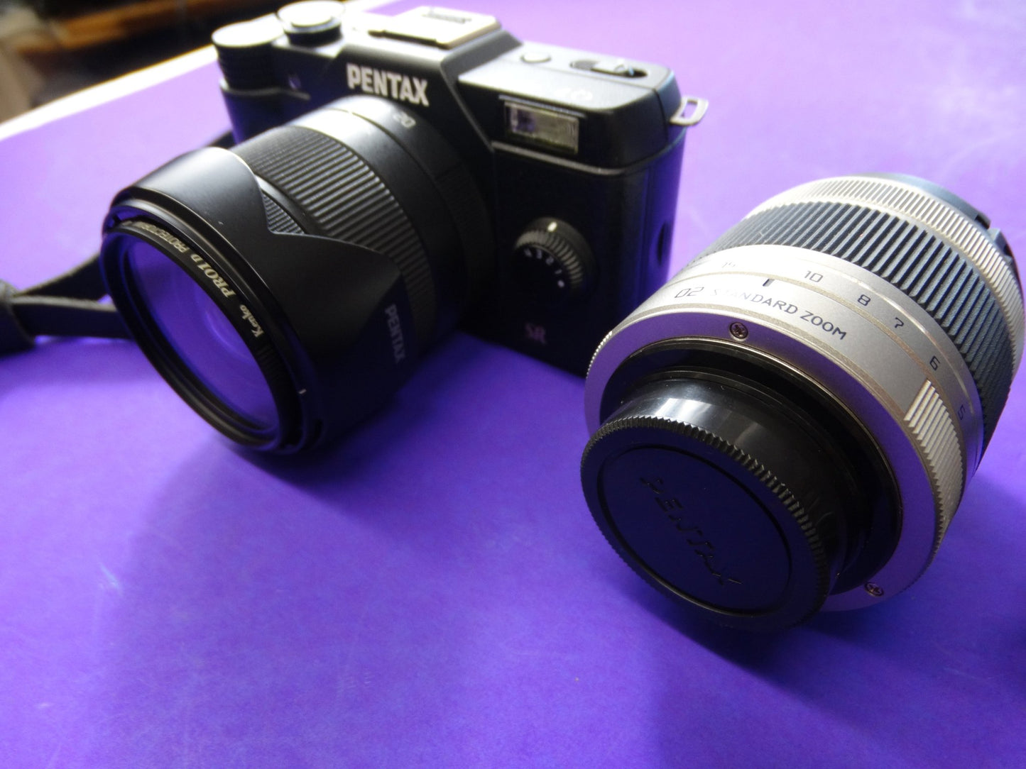 Pentax Q7 Mirrorless Camera Kit – Body + 2 Lenses (Pentax 02 Standard Zoom) + Charger & Strap - WeBuyElectronic